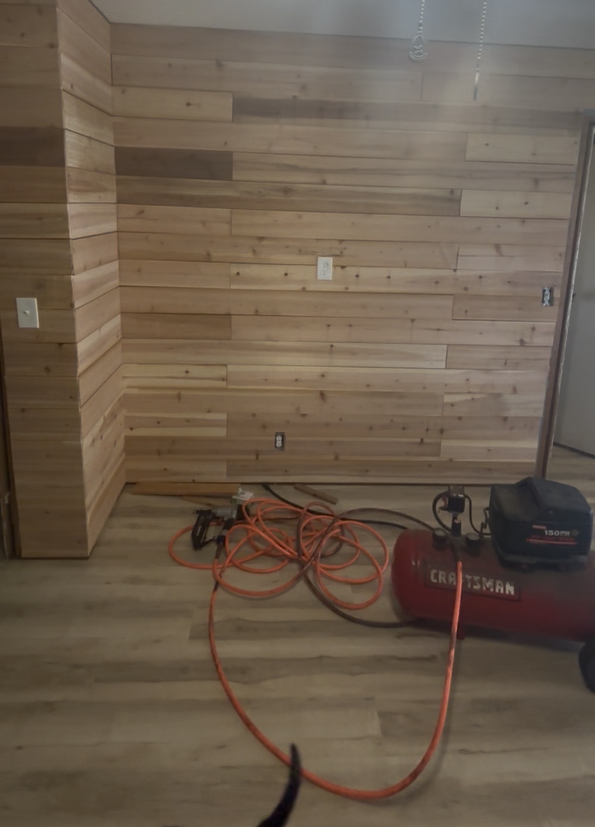 Cedar plank accent wall with mixed tones, wrapped corner and new wood-look floor